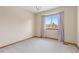 Bedroom with neutral paint and large window at 20816 E Shefield Pl, Parker, CO 80138