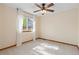 Bedroom with a ceiling fan and a large window at 20816 E Shefield Pl, Parker, CO 80138