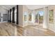 Bright living room features hardwood floors and a sliding door leading to the deck at 20816 E Shefield Pl, Parker, CO 80138