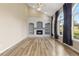 Inviting living room featuring a fireplace, built-in shelving, and large windows at 20816 E Shefield Pl, Parker, CO 80138