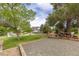 Well-manicured front yard features a cozy gravel area with a picnic table, perfect for outdoor enjoyment at 20816 E Shefield Pl, Parker, CO 80138