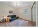 Cozy bedroom with a futon, rug, and a large window, offering a comfortable retreat at 26085 Amy Cir, Conifer, CO 80433