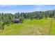 Charming home with multiple decks, nestled in a wooded area, surrounded by trees and greenery at 26085 Amy Cir, Conifer, CO 80433
