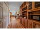 Charming kitchen featuring custom wood cabinets and a wine rack for ample storage space at 26085 Amy Cir, Conifer, CO 80433
