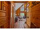 Inviting living room with hardwood floors and a high ceiling, creating a warm and welcoming atmosphere at 26085 Amy Cir, Conifer, CO 80433