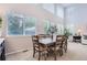 Dining area with tall ceilings and large windows creating a bright atmosphere at 10230 Lauren Ct, Highlands Ranch, CO 80130