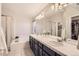 Bright main bathroom with double sinks, ample counter space, and separate shower and tub at 10230 Lauren Ct, Highlands Ranch, CO 80130