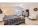 Spacious main bedroom featuring carpet floors, a ceiling fan, and bright windows at 10230 Lauren Ct, Highlands Ranch, CO 80130