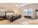 Inviting main bedroom with vaulted ceiling, carpet, and ample natural light at 10230 Lauren Ct, Highlands Ranch, CO 80130