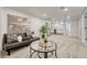 Cozy basement living room featuring modern furnishings and a convenient kitchenette at 3550 Eudora St, Denver, CO 80207