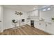 Finished basement with bar area, sleek cabinetry, modern stools, and a wine cooler at 3550 Eudora St, Denver, CO 80207