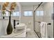 Modern bathroom with a unique vessel sink, stylish vanity, and glass-enclosed shower at 3550 Eudora St, Denver, CO 80207