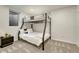 Cozy bedroom with a bunk bed and modern decor, illuminated by natural light at 3550 Eudora St, Denver, CO 80207