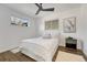 Clean and inviting bedroom with neutral tones, hardwood floors and natural light at 3550 Eudora St, Denver, CO 80207