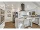 Modern kitchen featuring a center island with marble countertop, stainless steel appliances, and sleek cabinetry at 3550 Eudora St, Denver, CO 80207