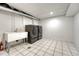 Functional laundry room equipped with modern washer and dryer units and a utility sink at 3550 Eudora St, Denver, CO 80207
