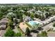 Panoramic aerial view of community featuring a pool, playground, and lush greenery in a serene setting at 12132 Huron St # 203, Denver, CO 80234