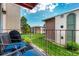 Relaxing balcony with chairs overlooking a well-maintained grassy courtyard and neighboring buildings at 12132 Huron St # 203, Denver, CO 80234