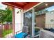 Cozy balcony with seating offers views of green space and buildings, perfect for outdoor relaxation at 12132 Huron St # 203, Denver, CO 80234