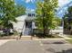 Charming two-story building featuring light siding, blue trim, and well-kept landscaping, inviting entrance at 12132 Huron St # 203, Denver, CO 80234