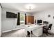 Office featuring a desk, large window and carpeted floors at 12132 Huron St # 203, Denver, CO 80234