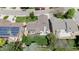Stunning aerial view of a home with a spacious backyard, deck, mature landscaping, and a charming neighborhood at 6386 S Pierson St, Littleton, CO 80127