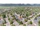 Desirable aerial view of neighborhood with mature landscaping, manicured lawns, and mountain views at 6386 S Pierson St, Littleton, CO 80127