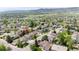 Desirable neighborhood offering a home with mature trees, landscaped yards, and mountain views in the background at 6386 S Pierson St, Littleton, CO 80127