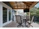 Inviting back deck with a covered dining area and mount TV perfect for enjoying the outdoors at 6386 S Pierson St, Littleton, CO 80127
