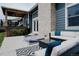 Inviting back patio featuring comfortable seating, a cozy lounge area, and an entertainment setup at 6386 S Pierson St, Littleton, CO 80127