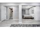 Finished basement features a bathroom, murphy bed, walk-in shower, and a neutral color palette at 6386 S Pierson St, Littleton, CO 80127