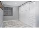 Finished basement bedroom includes a murphy bed and built-in wardrobe with a large window at 6386 S Pierson St, Littleton, CO 80127
