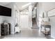 Bright foyer features stylish decor, a staircase leading up, and hardwood floors at 6386 S Pierson St, Littleton, CO 80127