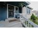 Inviting front porch with decorative railing and a cozy rocking chair create a warm welcome to the home at 6386 S Pierson St, Littleton, CO 80127