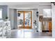 Open concept kitchen features stainless steel appliances and a sliding door to a private deck at 6386 S Pierson St, Littleton, CO 80127