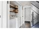 Efficient laundry room with front load washer/dryer and convenient built-in shelving at 6386 S Pierson St, Littleton, CO 80127