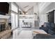 Open concept living room with fireplace and staircase at 6386 S Pierson St, Littleton, CO 80127