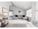 Cozy living room with vaulted ceilings, neutral decor, and a large sectional sofa perfect for relaxing at 6386 S Pierson St, Littleton, CO 80127