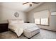 Well-lit main bedroom with large windows, ceiling fan, and neutral color scheme at 6386 S Pierson St, Littleton, CO 80127