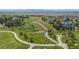 Enjoy walking trails winding through the lush neighborhood with beautiful trees and scenic views at 4887 Raven Run, Broomfield, CO 80023