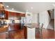Kitchen island with stainless steel appliances and granite countertops at 4887 Raven Run, Broomfield, CO 80023