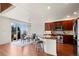 Modern kitchen featuring stainless steel appliances and a breakfast bar at 4887 Raven Run, Broomfield, CO 80023