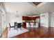 Open-concept living and kitchen area featuring hardwood floors and modern finishes at 4887 Raven Run, Broomfield, CO 80023