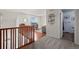 Upstairs loft area with a desk and view of the downstairs at 4887 Raven Run, Broomfield, CO 80023