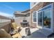 Private patio with comfortable seating, grill, and a fire pit for outdoor enjoyment at 4887 Raven Run, Broomfield, CO 80023