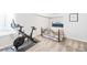 Basement bedroom with exercise bike and bed at 1503 S Buckley Way, Aurora, CO 80017
