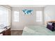 Bright bedroom with a queen bed and neutral decor at 1503 S Buckley Way, Aurora, CO 80017