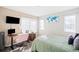 Bedroom with workspace, bed and window coverings at 1503 S Buckley Way, Aurora, CO 80017