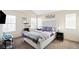 Bedroom with a queen-size bed and neutral decor at 1503 S Buckley Way, Aurora, CO 80017