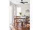 Well-lit dining area with four chairs, and a ceiling fan at 1503 S Buckley Way, Aurora, CO 80017